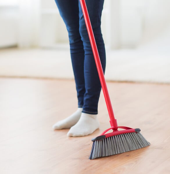 Sweeping laminate floor in Tallahassee, FL | Georgia Flooring